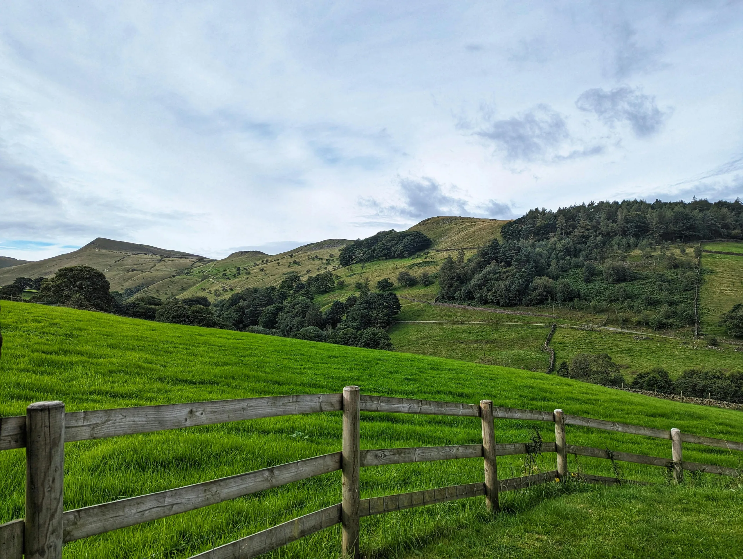 Scenic English countryside hills in summer with rolling green fields